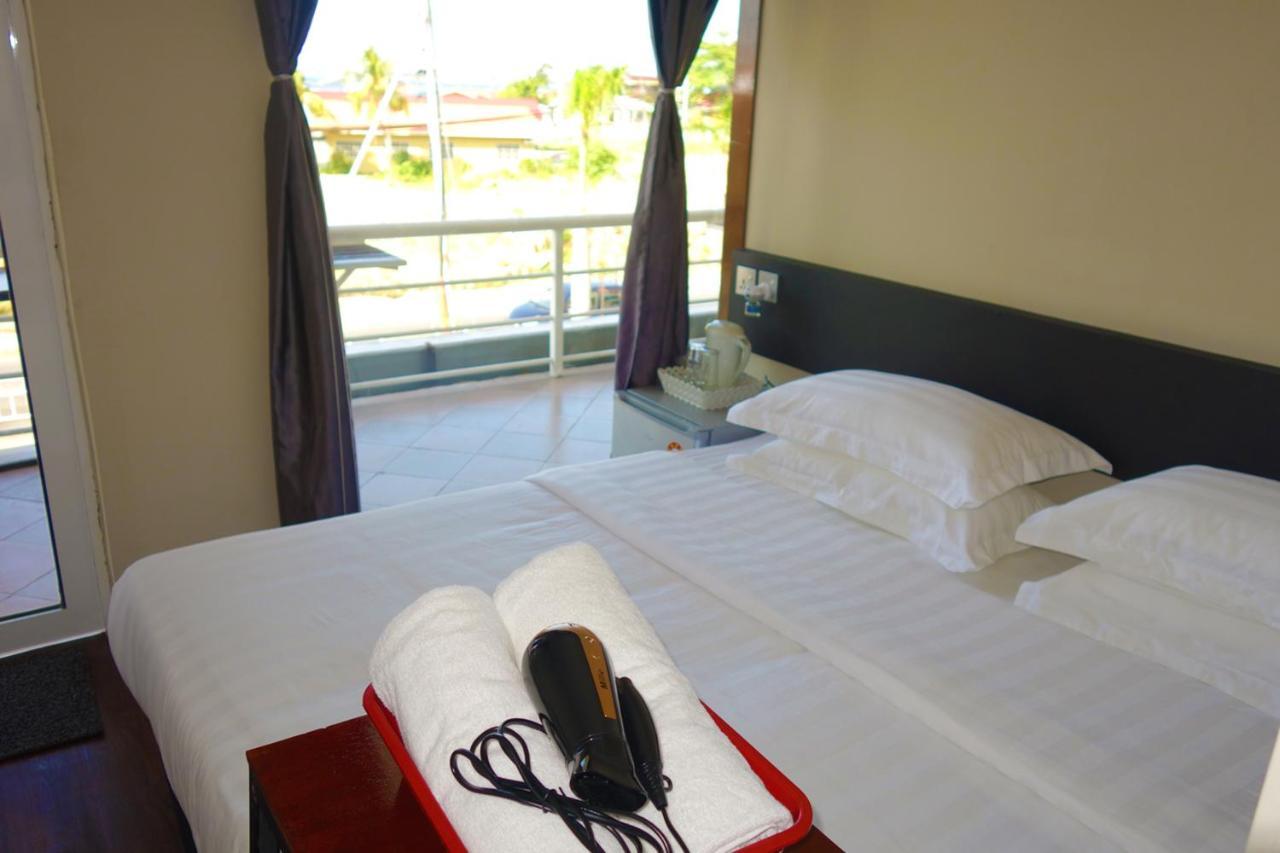 Ae Semporna Guesthouse 极潜旅店 Bagian luar foto